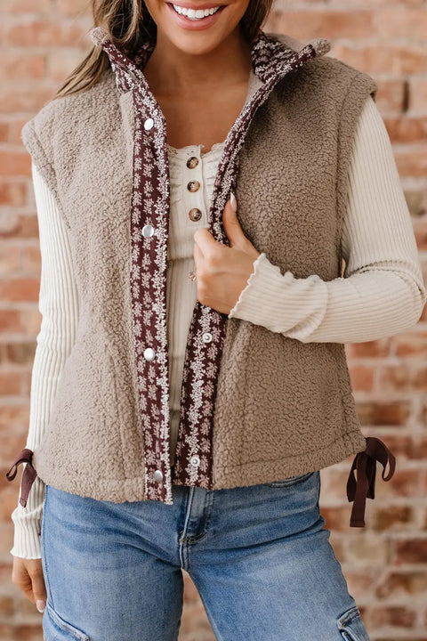 Women's Country Borg Fleece Gilet Winter Vest FashionFitz in khaki with sherpa texture, floral trim, and snap buttons styled with casual jeans.