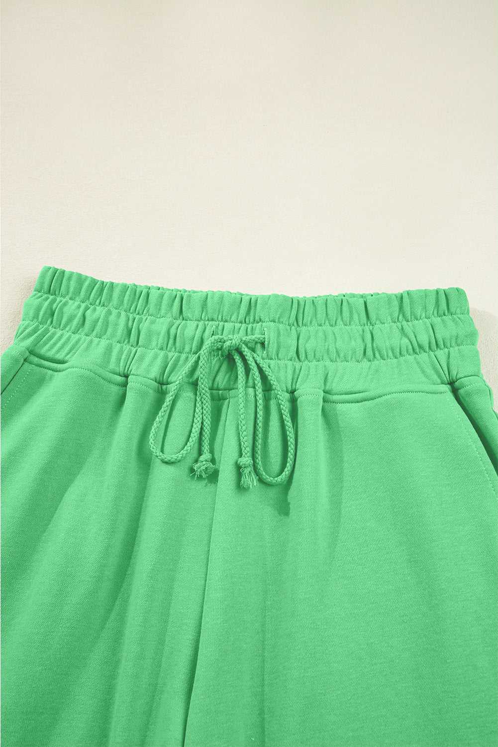 Drawstring waistband detail of green Drop Crop Wide-Leg Pants Set, designed for adjustable fit and everyday ease.