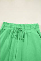 Drawstring waistband detail of green Drop Crop Wide-Leg Pants Set, designed for adjustable fit and everyday ease.