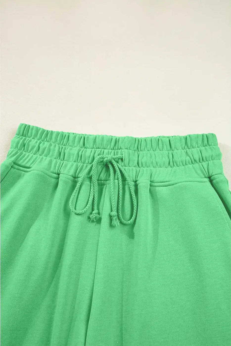 Drawstring waistband detail of green Drop Crop Wide-Leg Pants Set, designed for adjustable fit and everyday ease.