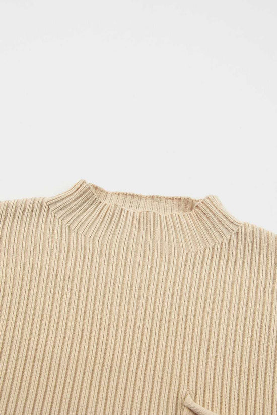 Close-up of the mock neck detail on the oatmeal ribbed knit sweater dress, highlighting the soft and cozy texture.