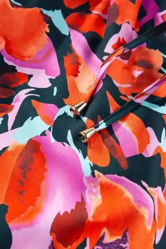 Drawstring detail on Abstract Floral Shirred Puff Sleeve Blouse | FashionFitz, featuring gold-tipped ties and multicolor floral print.