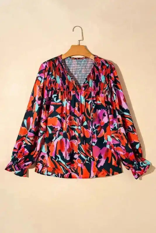 Abstract Floral Shirred Puff Sleeve Blouse | FashionFitz displayed on hanger, showing the full blouse design with shirred top and multicolor floral print.