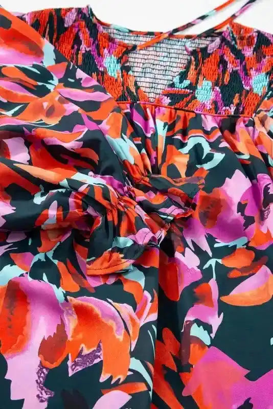 Sleeve detail of Abstract Floral Shirred Puff Sleeve Blouse | FashionFitz, showcasing gathered cuff and vibrant floral fabric.