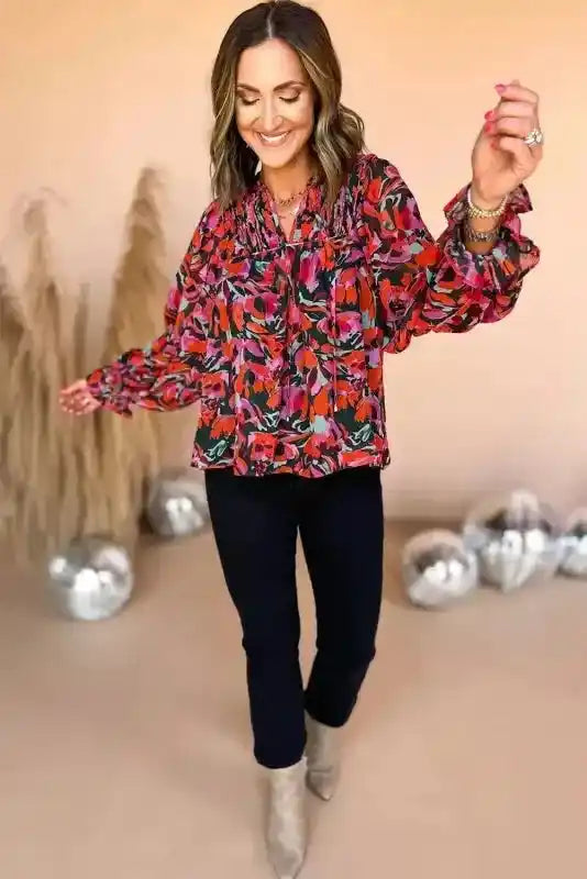 Full outfit view of Abstract Floral Shirred Puff Sleeve Blouse | FashionFitz paired with black pants and boots, ideal for a stylish spring look.