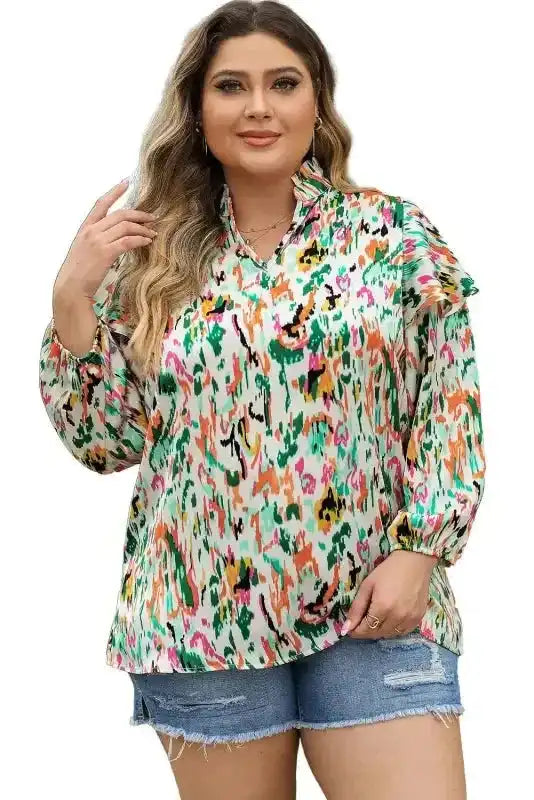 Studio shot of Abstract Ruffle Blouse with Puff Sleeves - Unique Style, V Neck, ideal for chic and colorful everyday wear.