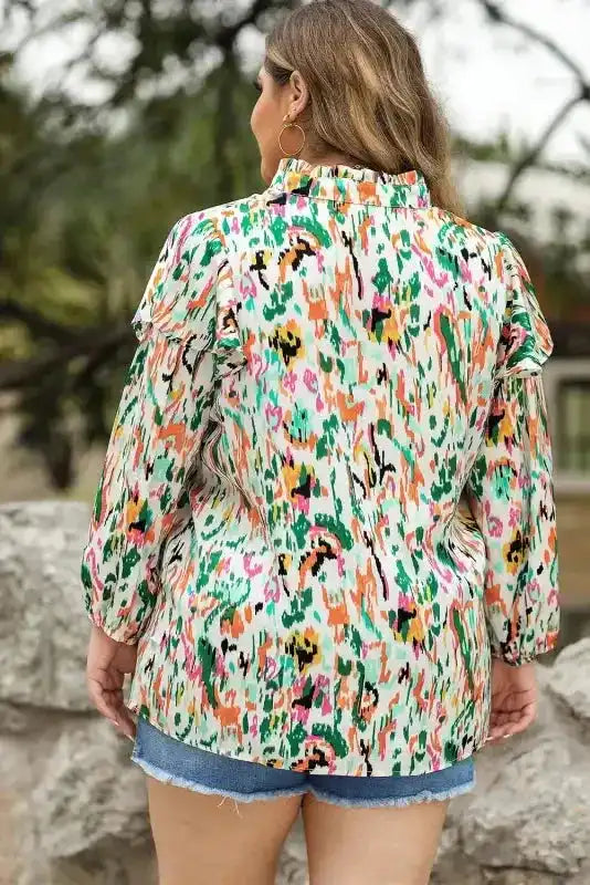 Back view of plus-size Abstract Ruffle Blouse with Puff Sleeves, showing vibrant abstract design and flattering fit.