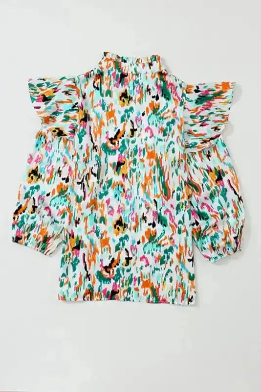 Back view of Abstract Ruffle Blouse with Puff Sleeves showing vibrant abstract pattern and relaxed fit for stylish comfort.