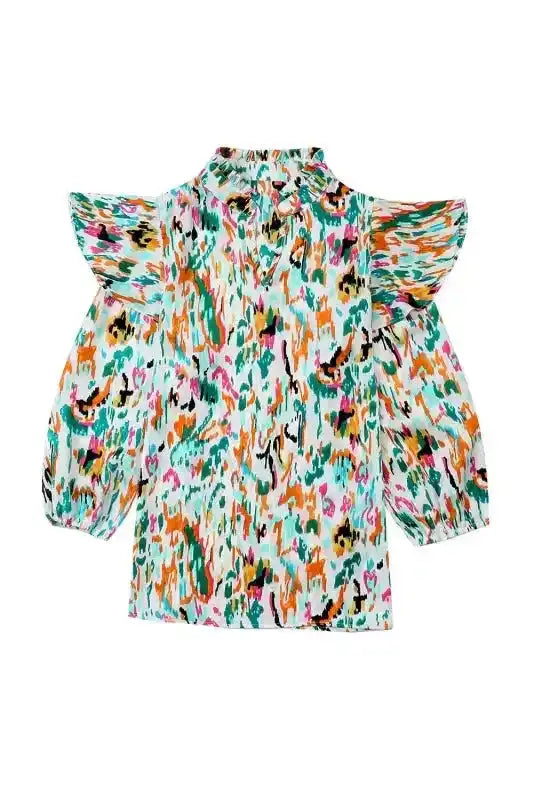 Flat lay of Abstract Ruffle Blouse with Puff Sleeves in vivid multicolor, showcasing structured ruffles and puffed sleeves.