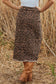 Back view of Leopard Denim Midi Skirt - Summer Fashion by FashionFitz showing rear pockets and raw hem finish.