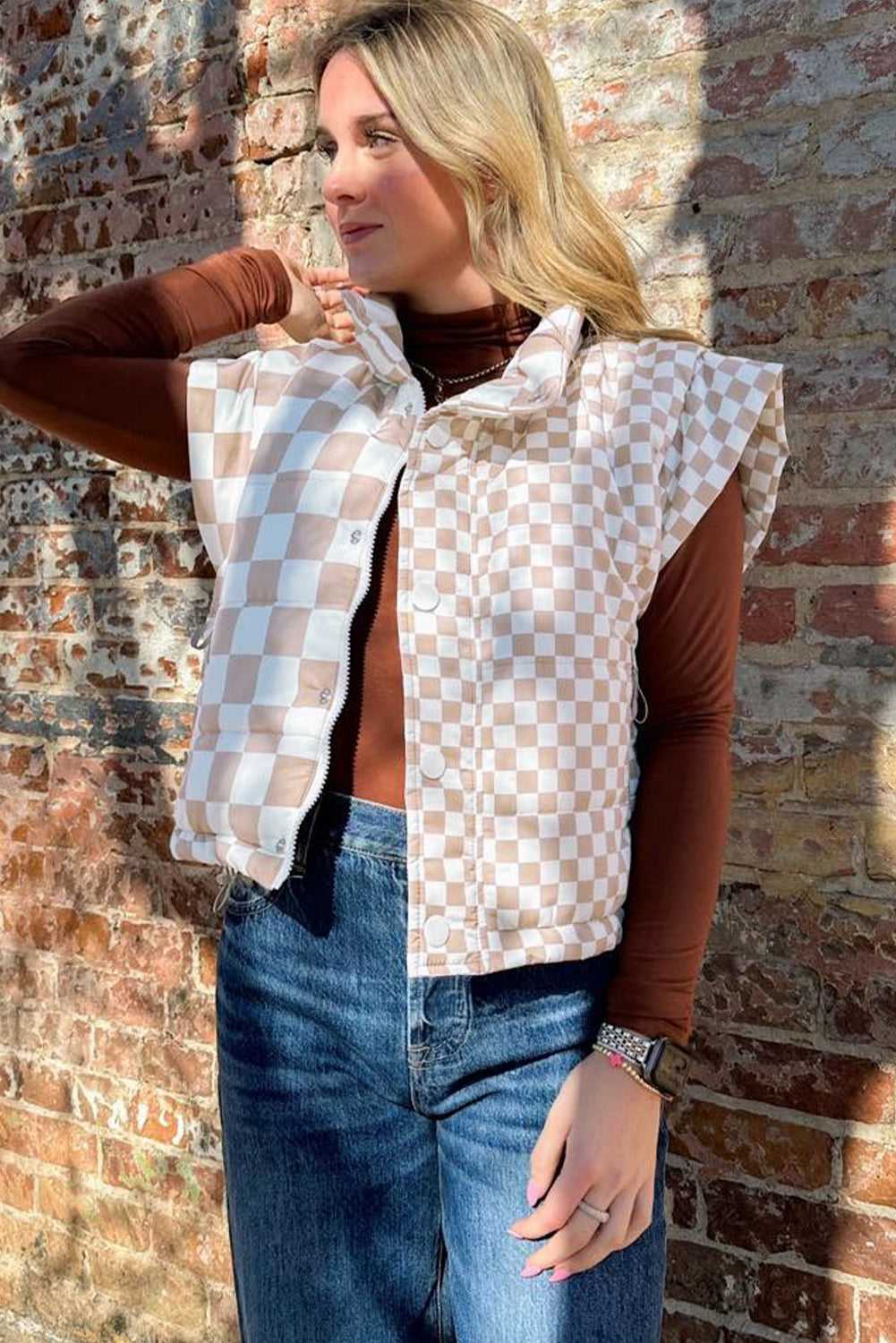 FashionFitz khaki plaid quilted gilet worn outdoors, showcasing sleeveless cut and dual-closure design for casual winter outerwear.