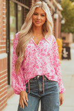 Model wearing Pink Floral Lightweight Blouse outdoors with jeans, perfect for spring casual outings.