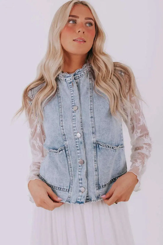 Model wearing Beau Blue Scallop‑Trim Denim Waistcoat paired with white dress, showcasing its casual and feminine gilet style.