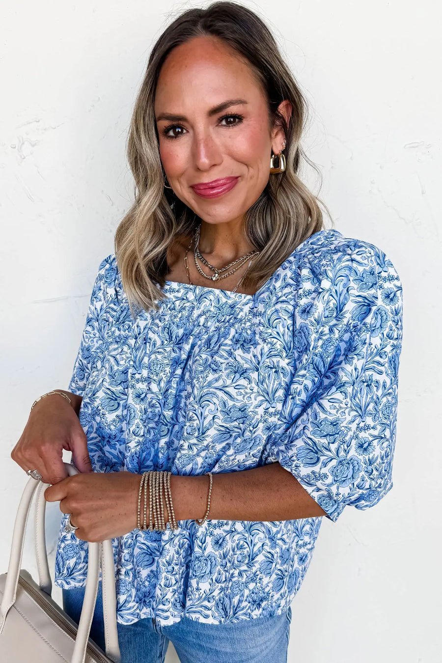 Close-up of Sky Blue Floral Square Neck Puff Sleeve Blouse showing soft blue floral print and pleated fabric — Fashionfitz