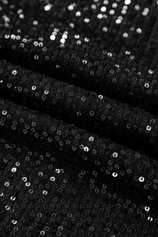 Close-up of black sequin fabric showing shimmering texture, used in elegant open back party tops for night out occasions.