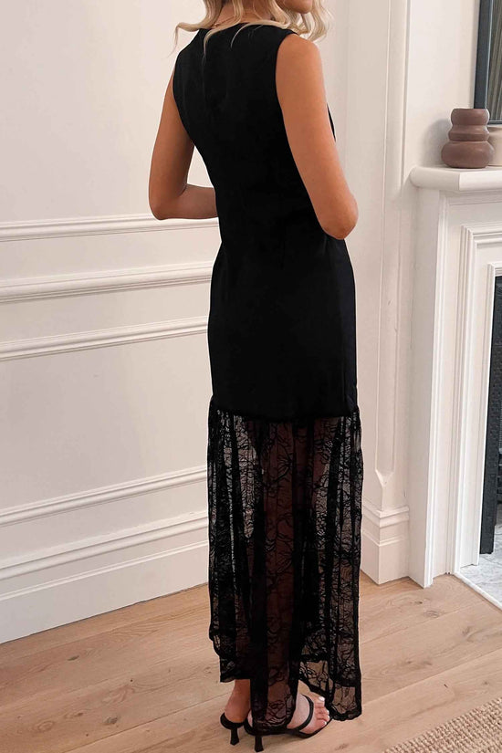 Back view of Black Sleeveless Lace Maxi Dress with sheer lace hem, showcasing its elegant silhouette and summer-ready design.