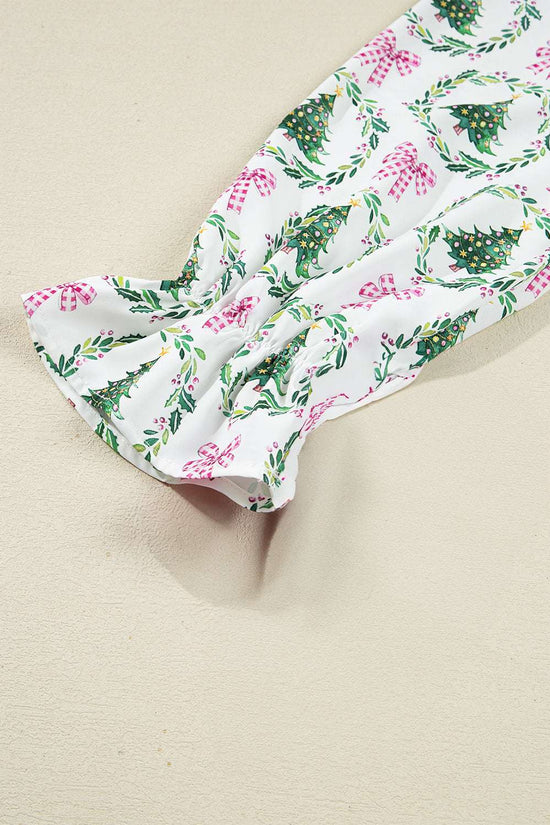 Sleeve detail of White Christmas Print Velvet Trim Pyjamas with gathered cuff and holiday wreath and bow pattern on soft fabric.