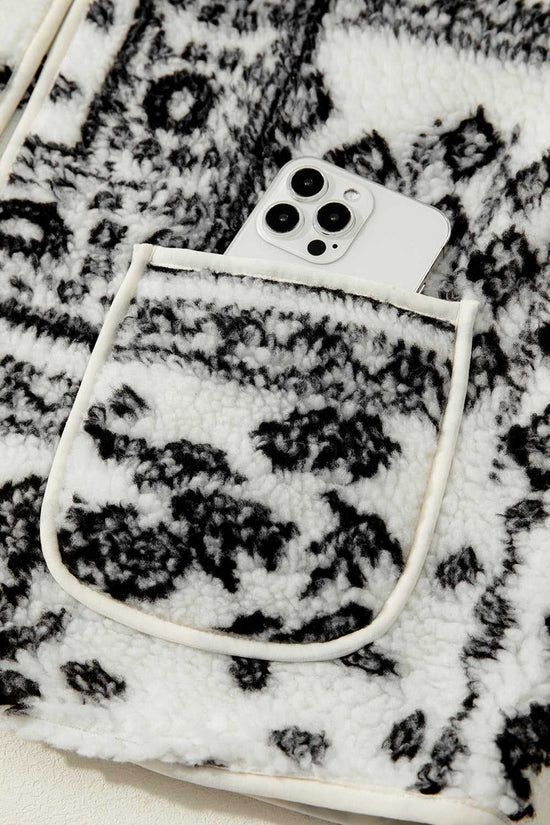 Front pocket of Paisley Sherpa Gilet holding a smartphone, showcasing functionality and stylish Western design.