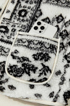 Front pocket of Paisley Sherpa Gilet holding a smartphone, showcasing functionality and stylish Western design.