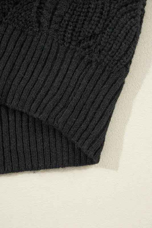 Airy charm drop sweater: black knitted sweater with ribbed texture. Relax relax in style