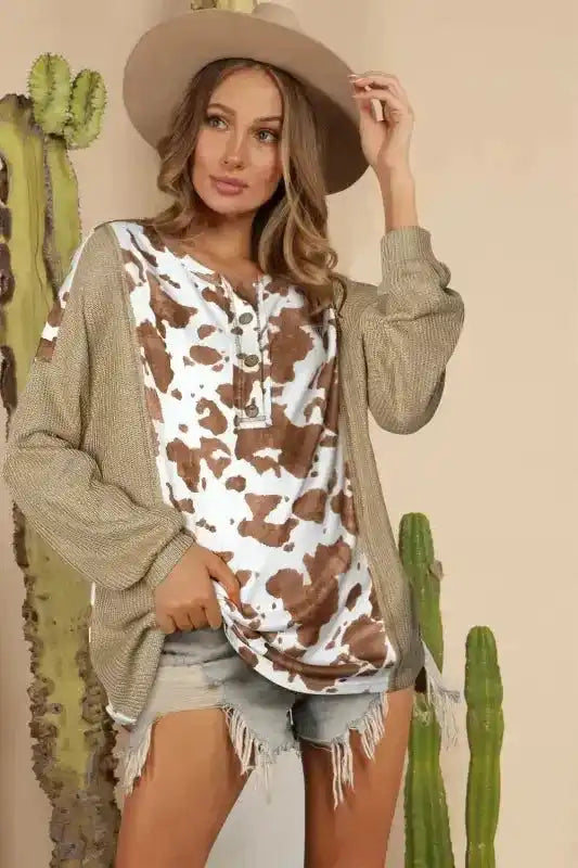 FashionFitz Animal Print Textured Henley Blouse featuring long bat sleeves, stretchable fabric, and a western-inspired casual look.