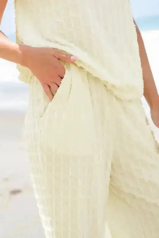 Close-up of pocket detail on Apricot Lattice Pants, showcasing textured fabric and casual design.