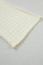 Close-up of flared pant leg from Apricot Lattice Set showing detailed textured lattice fabric.