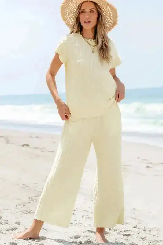 Apricot Lattice Set - Two Piece with batwing sleeve top and flared pants, styled for summer beachwear in textured fabric.