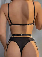 Back view of Arabella 4-Piece Garter Set in black showing adjustable straps and mesh fabric. Luxe lingerie for women in the UK.