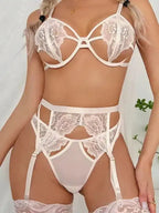 Close-up of Arabella 4-Piece Garter Set in white with floral lace and sheer panels. Buy women’s lingerie UK with free returns.