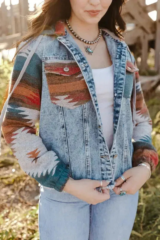 Woman wearing multicolor Aztec print hooded denim jacket with frayed hem front view Fashionfitz UK