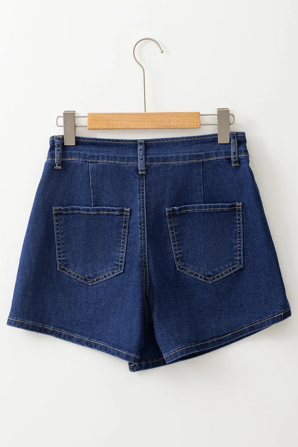 Bluing asymmetric wrapped buttoned high waist denim shorts