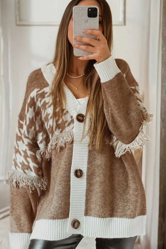 Longline khaki knit cardigan with white houndstooth pattern and fringe accents. A stylish layering piece for casual or smart-casual outfits.