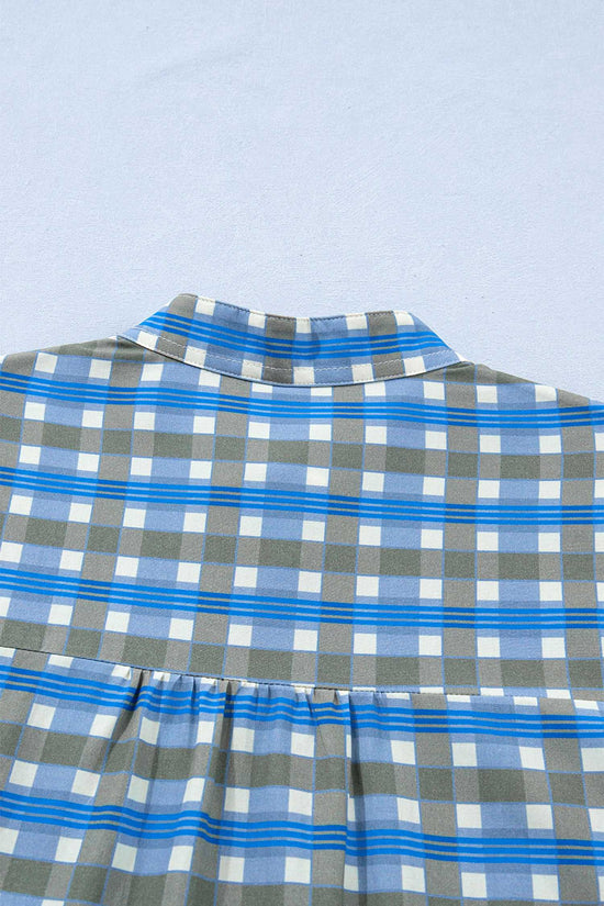 Back view of blue plaid frilled blouse with gathered yoke and breathable cotton texture, perfect for spring casual outfits.