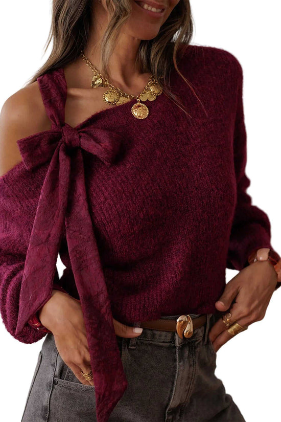 Burgundy lace bow sweater for women with asymmetric off-shoulder neckline and long sleeves. Elegant fall knitwear top for night-out outfits.