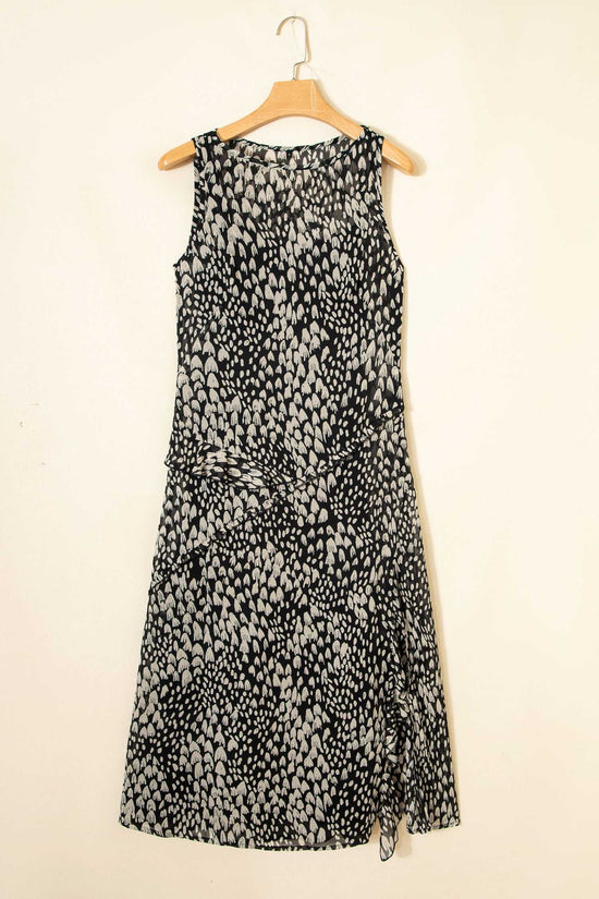Black Floral Sleeveless Maxi Dress on hanger featuring all-over floral print and flowy summer-ready design in lightweight fabric.