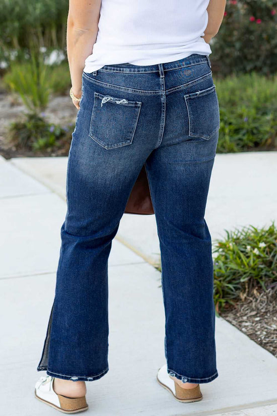 Back view of Dirty Blue Side‑Slit Flare Jeans – Curve showing high waist and rear pockets in plus size denim for casual fall fashion.