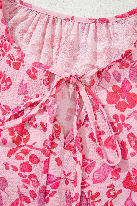 Detailed view of tie-neck design on Pink Floral Lightweight Blouse, emphasizing its soft texture and floral pattern.