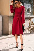 Fashionable Red Long Sleeve Drape Midi Dress styled with a black hat and clutch, perfect for seasonal street style.