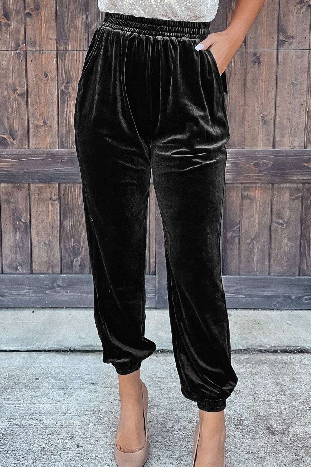 Black Velvet Jogger Trousers for women with elastic waistband and side pockets, styled for casual fall loungewear by FashionFitz.