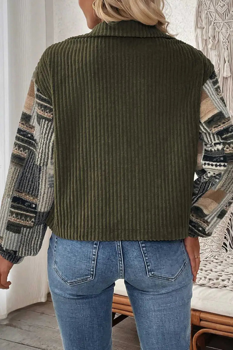 Back view of Women's Green Plaid Corduroy Fleece Jacket showcasing solid green ribbed corduroy fabric and patterned sleeves.