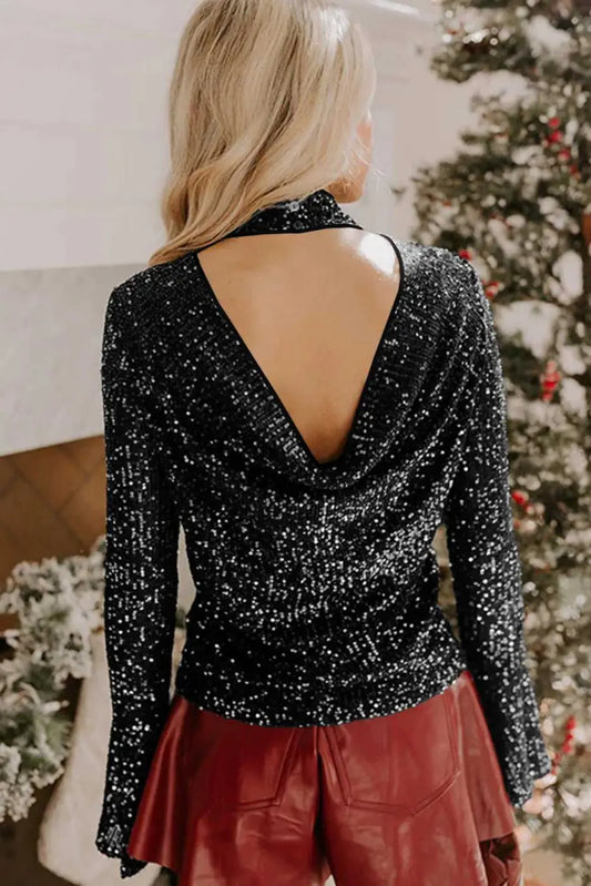 Back view of black open back sequin party top with shimmering detail and draped cut-out, perfect for night out styling.