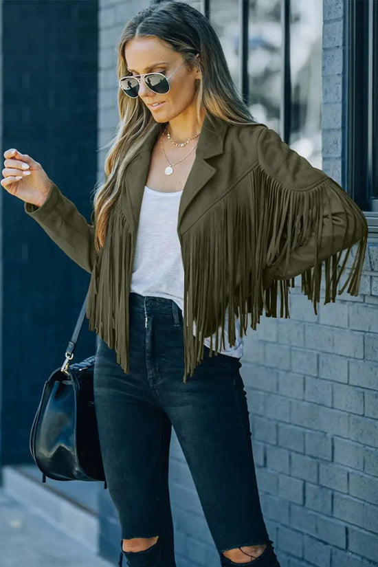 Green cropped fringe faux suede jacket styled with black skinny jeans and sunglasses, perfect for casual fall western-inspired outfits.