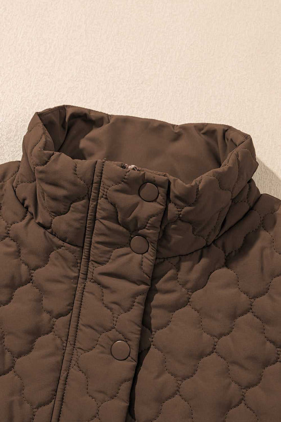 Close-up of high collar and snap buttons on brown Flower‑Quilted Winter Gilet, highlighting padded warmth and floral quilted texture.