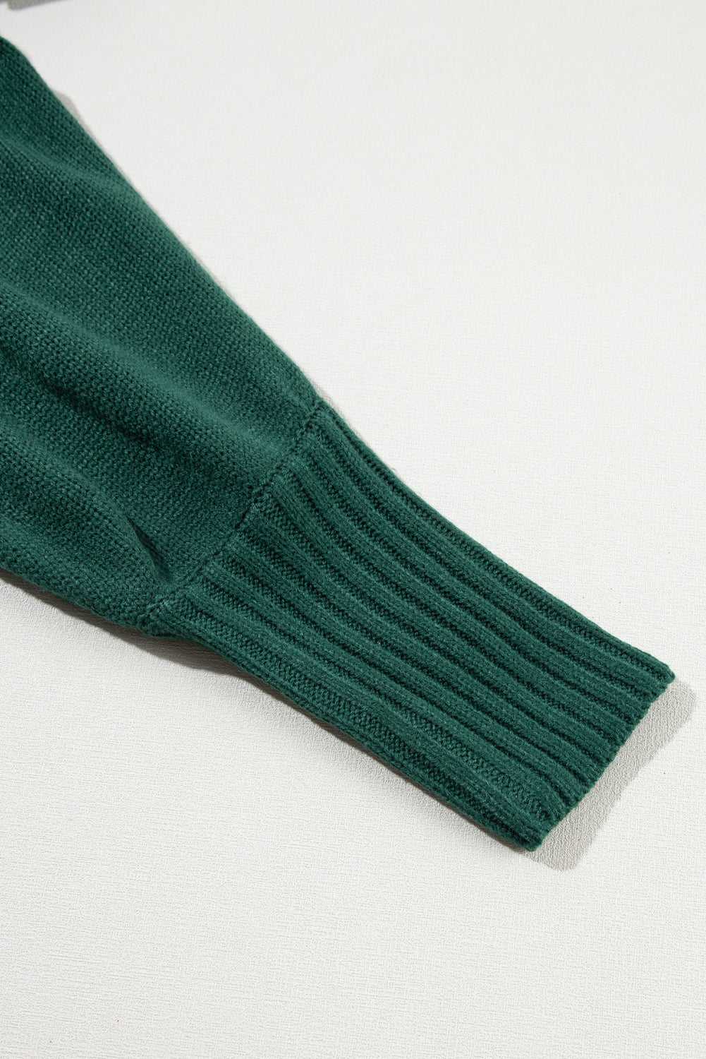 Detailed sleeve cuff of green Stylish High Neck Red Sweater - Christmas, highlighting ribbed texture and thick winter knit.