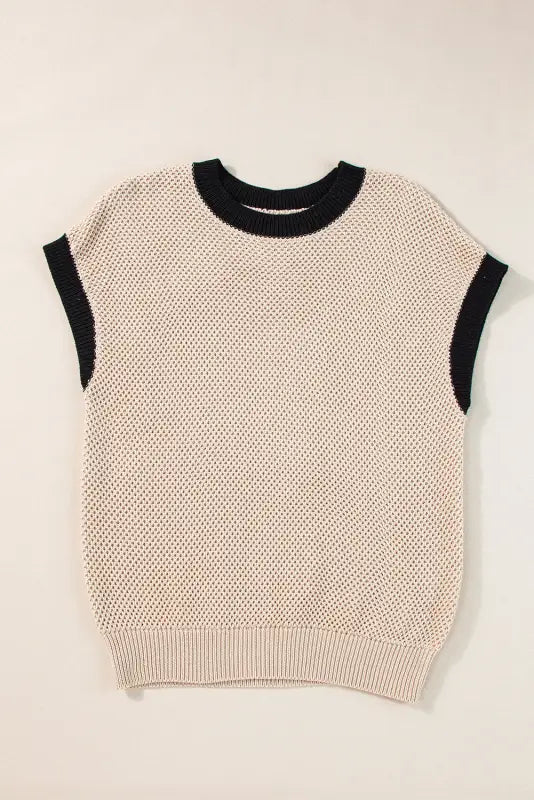 Light french beige sleeveless knit sweater with cream body and black trim for relaxed style