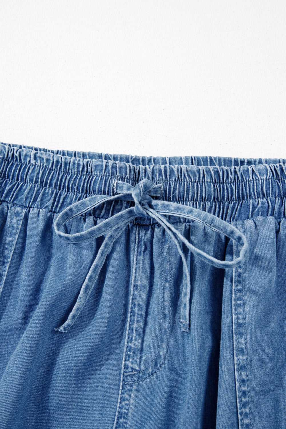 Close-up of drawstring waistband on Plus Size Blue Denim Joggers, emphasizing adjustable fit and elastic comfort for daily wear.