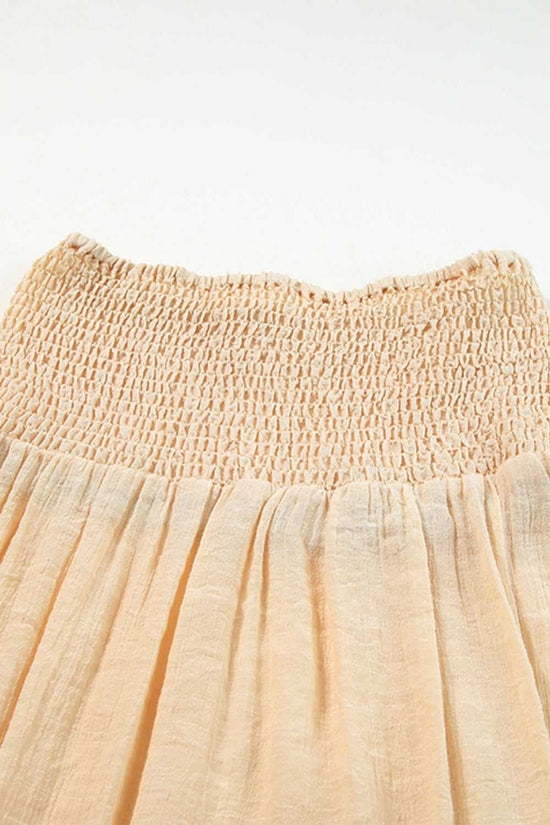Close-up of beige shirred beach skirt waistband