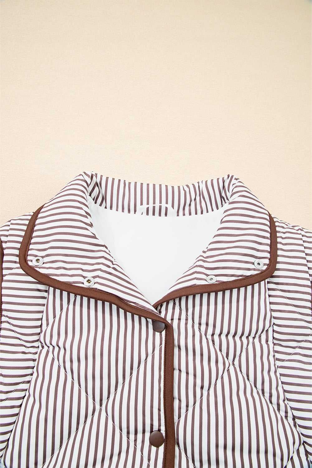 Close-up of the collared neckline and snap buttons on the Stripe Snap Winter Vest, showcasing its cozy and structured design.