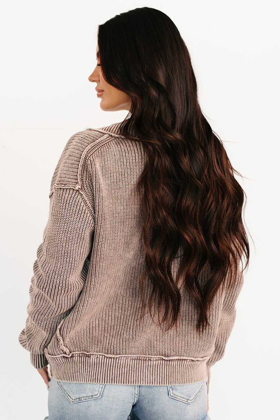Back view of woman in brown stonewash patchwork knit open cardigan showing ribbed knit texture and relaxed silhouette for fall fashion.
